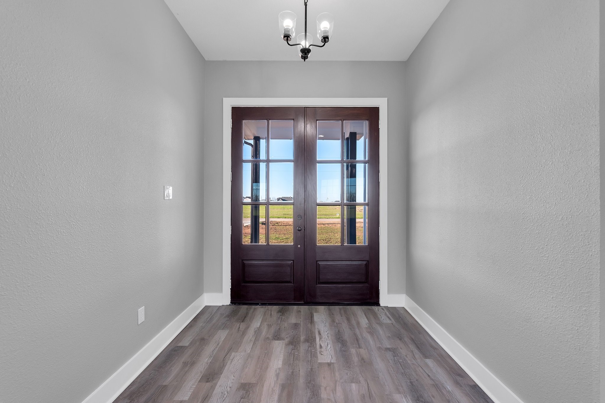 519 Chuckwagon Trail Angleton, TX 77515 - Photo 5 of 34 wooden floor in an empty room with a window