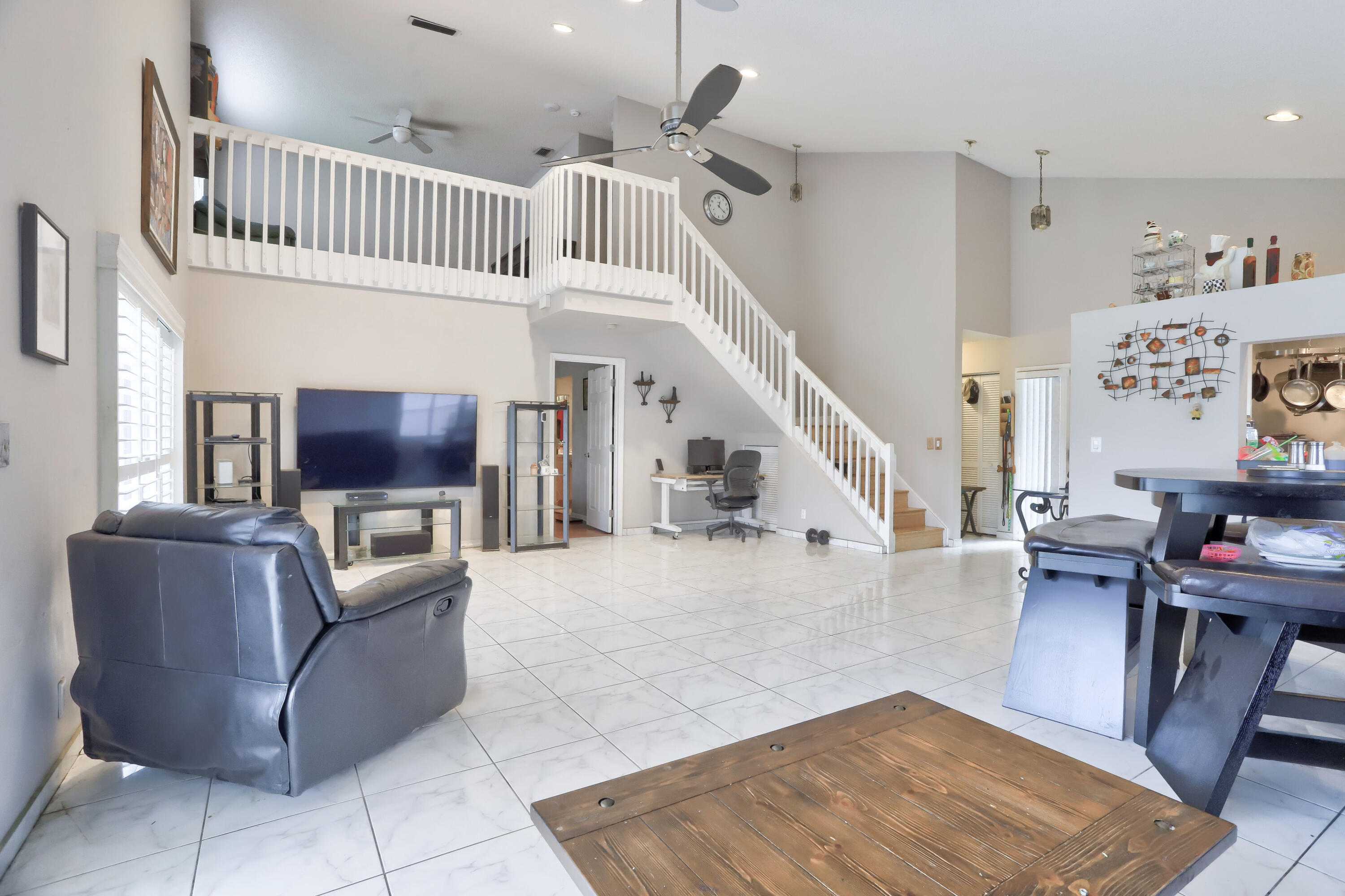 7427 Shell Ridge Terrace Lake Worth, FL 33467 - Photo 12 of 27 a living room with furniture and a flat screen tv