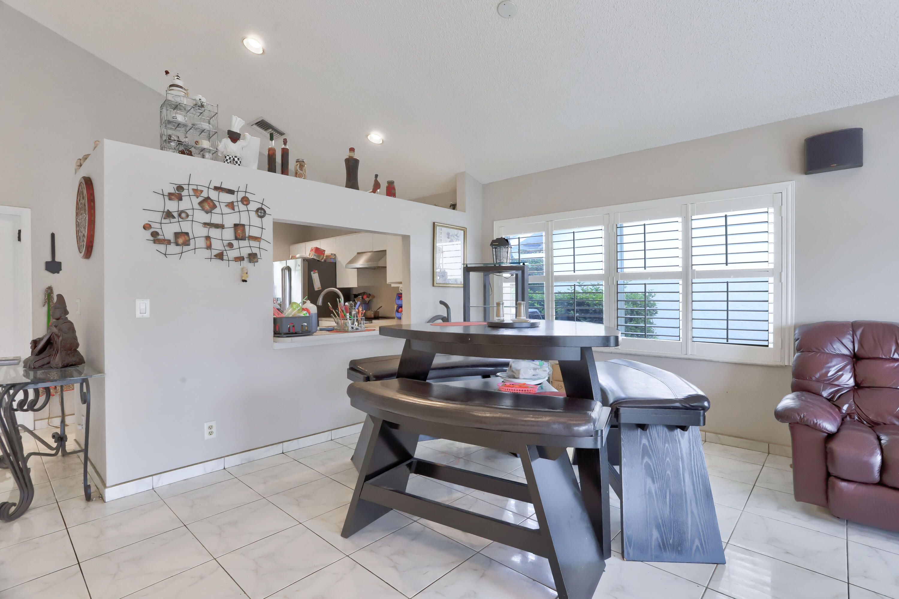 7427 Shell Ridge Terrace Lake Worth, FL 33467 - Photo 13 of 27 a dining room with furniture and window