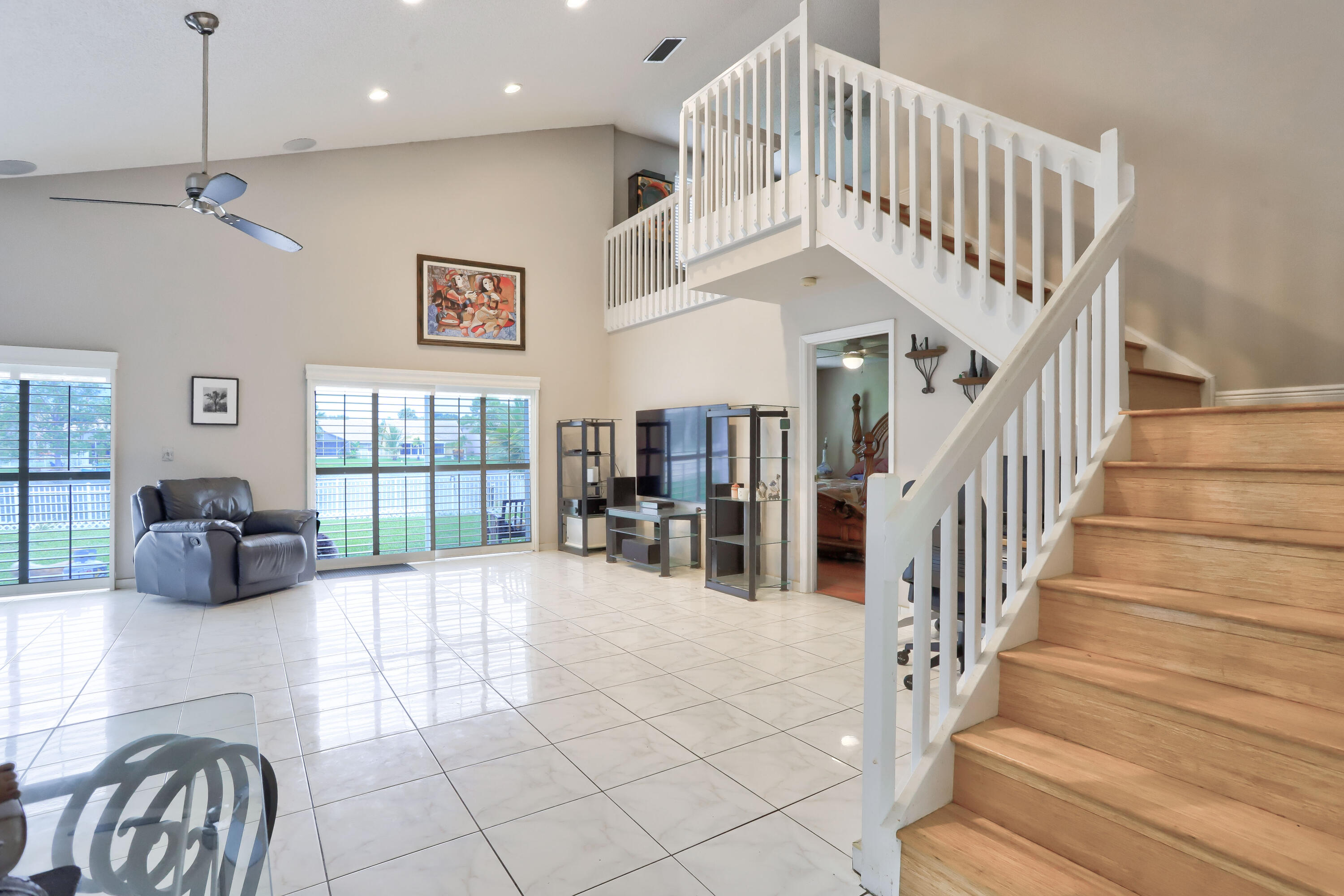 7427 Shell Ridge Terrace Lake Worth, FL 33467 - Photo 14 of 27 a view of entryway and hall with a dining table