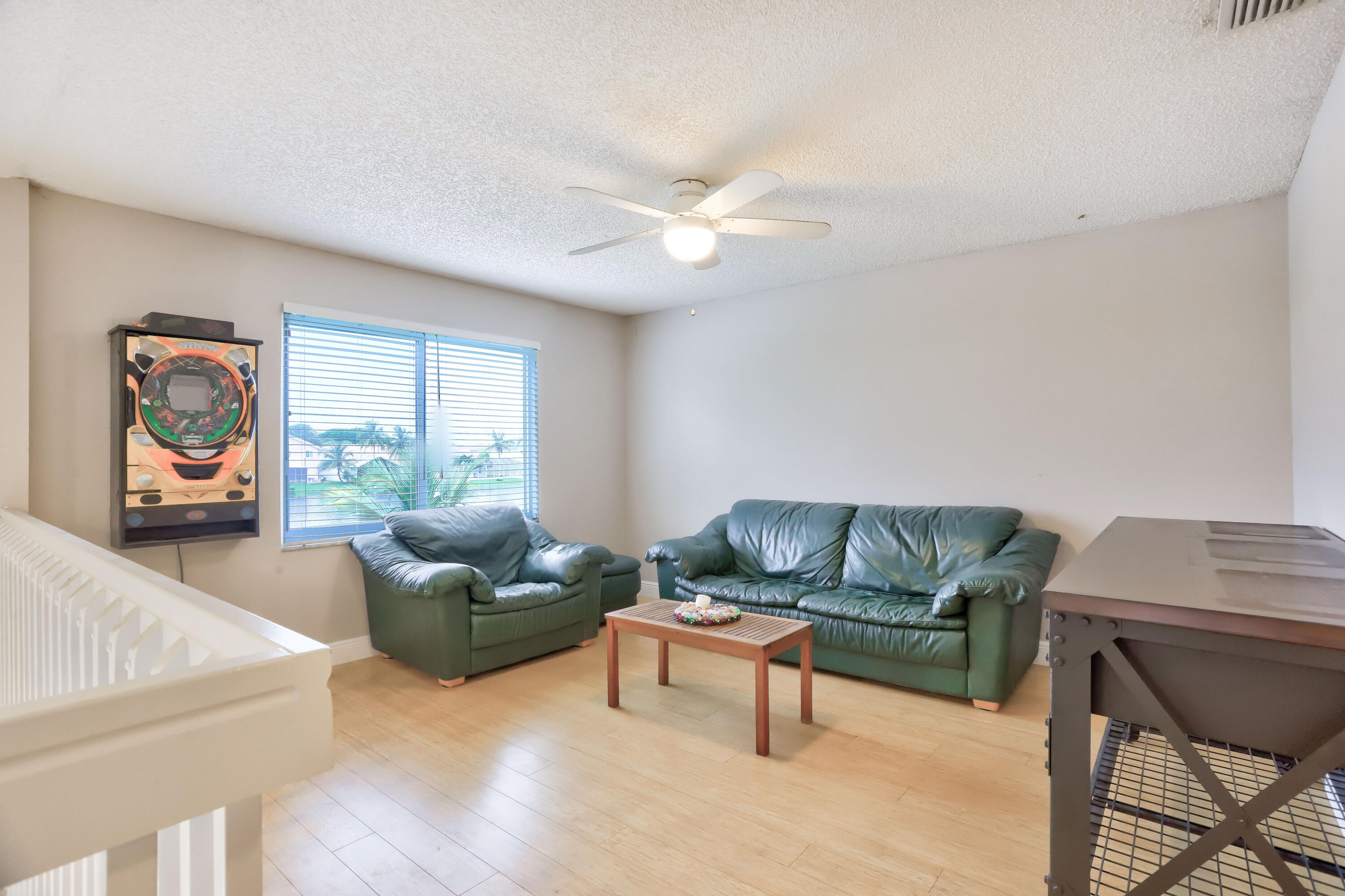 7427 Shell Ridge Terrace Lake Worth, FL 33467 - Photo 17 of 27 a living room with furniture and a flat screen tv