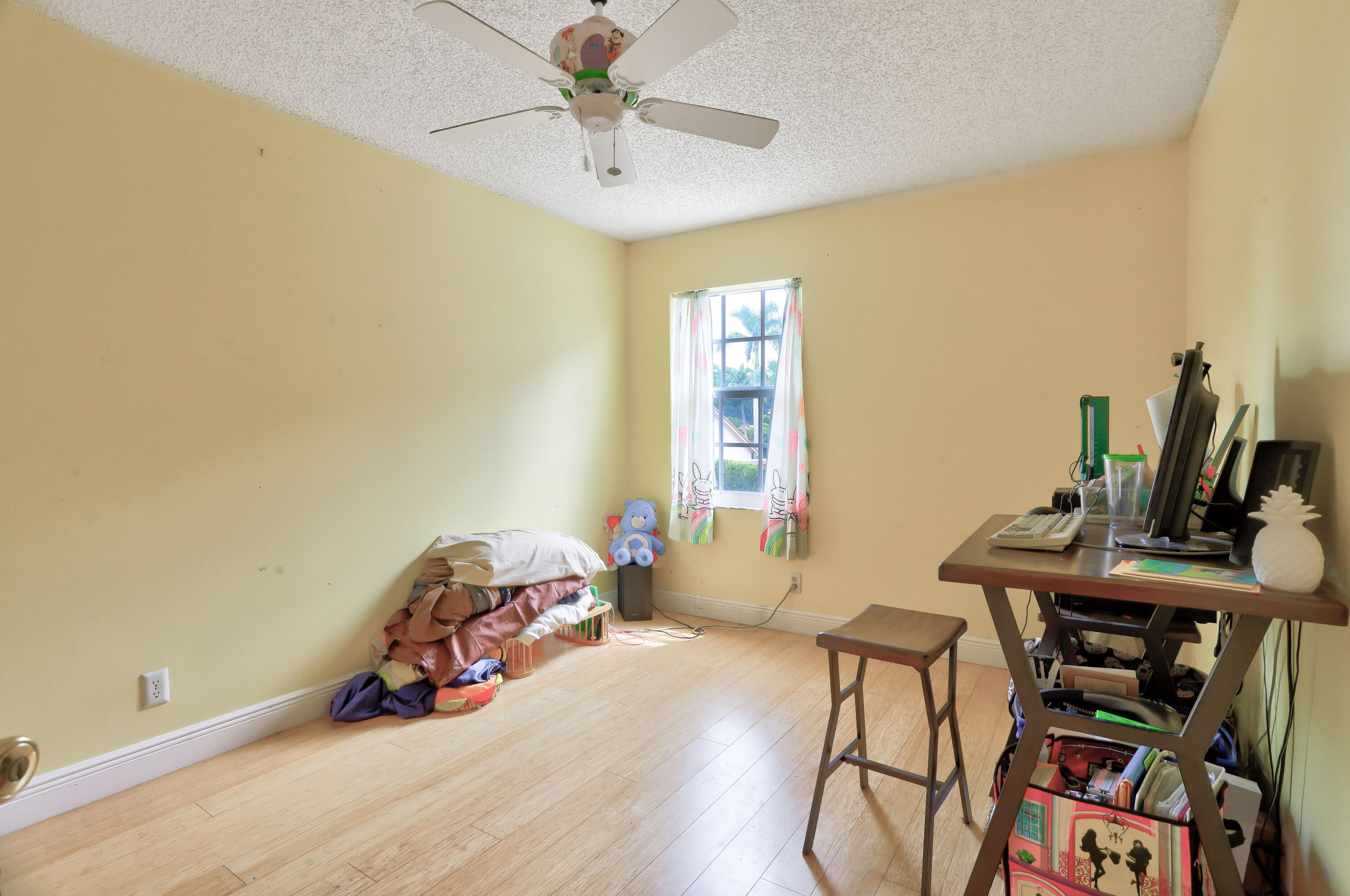 7427 Shell Ridge Terrace Lake Worth, FL 33467 - Photo 20 of 27 a bedroom with a bed and wooden floor