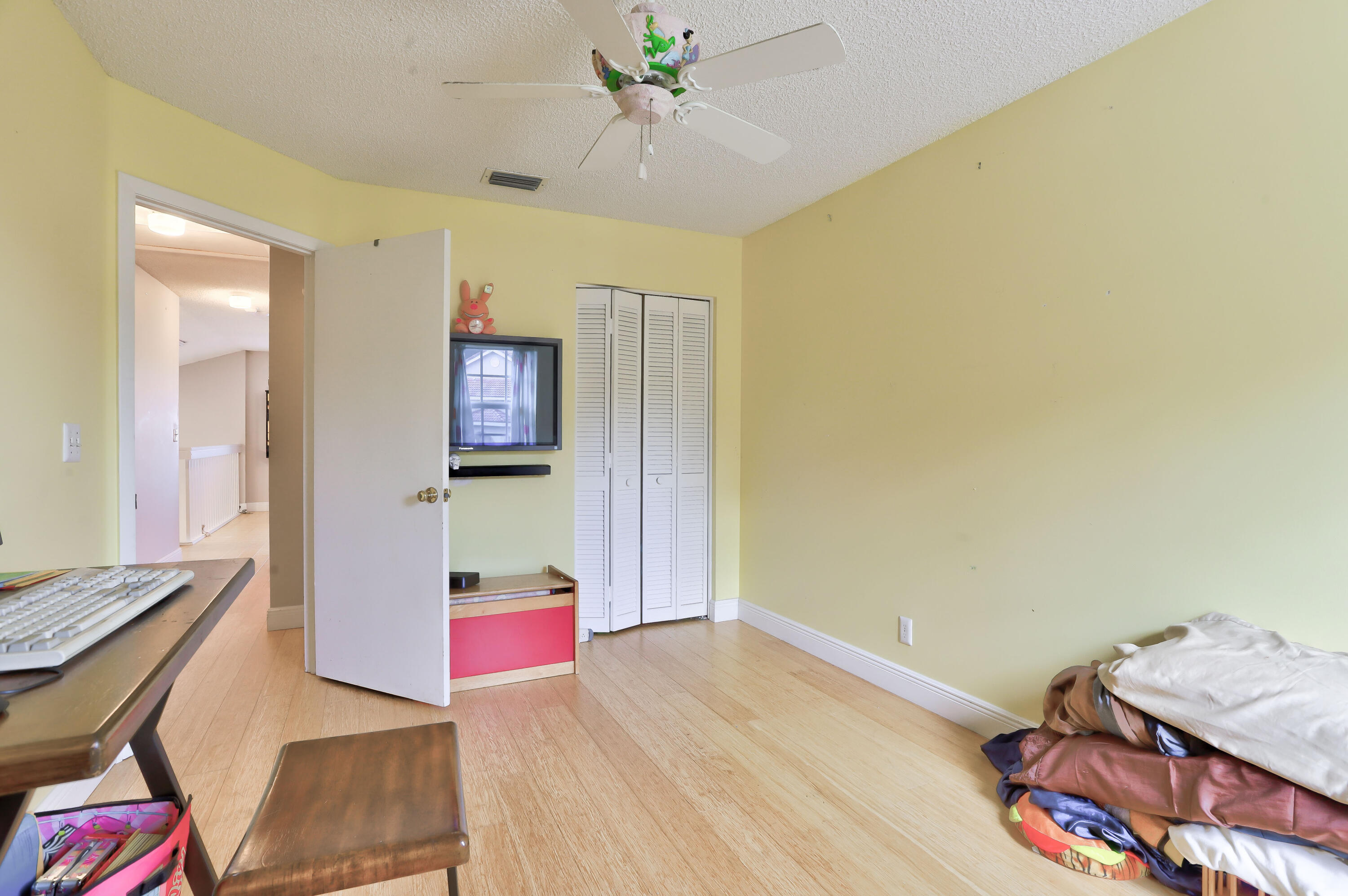 7427 Shell Ridge Terrace Lake Worth, FL 33467 - Photo 21 of 27 a living room with furniture and a wooden floor