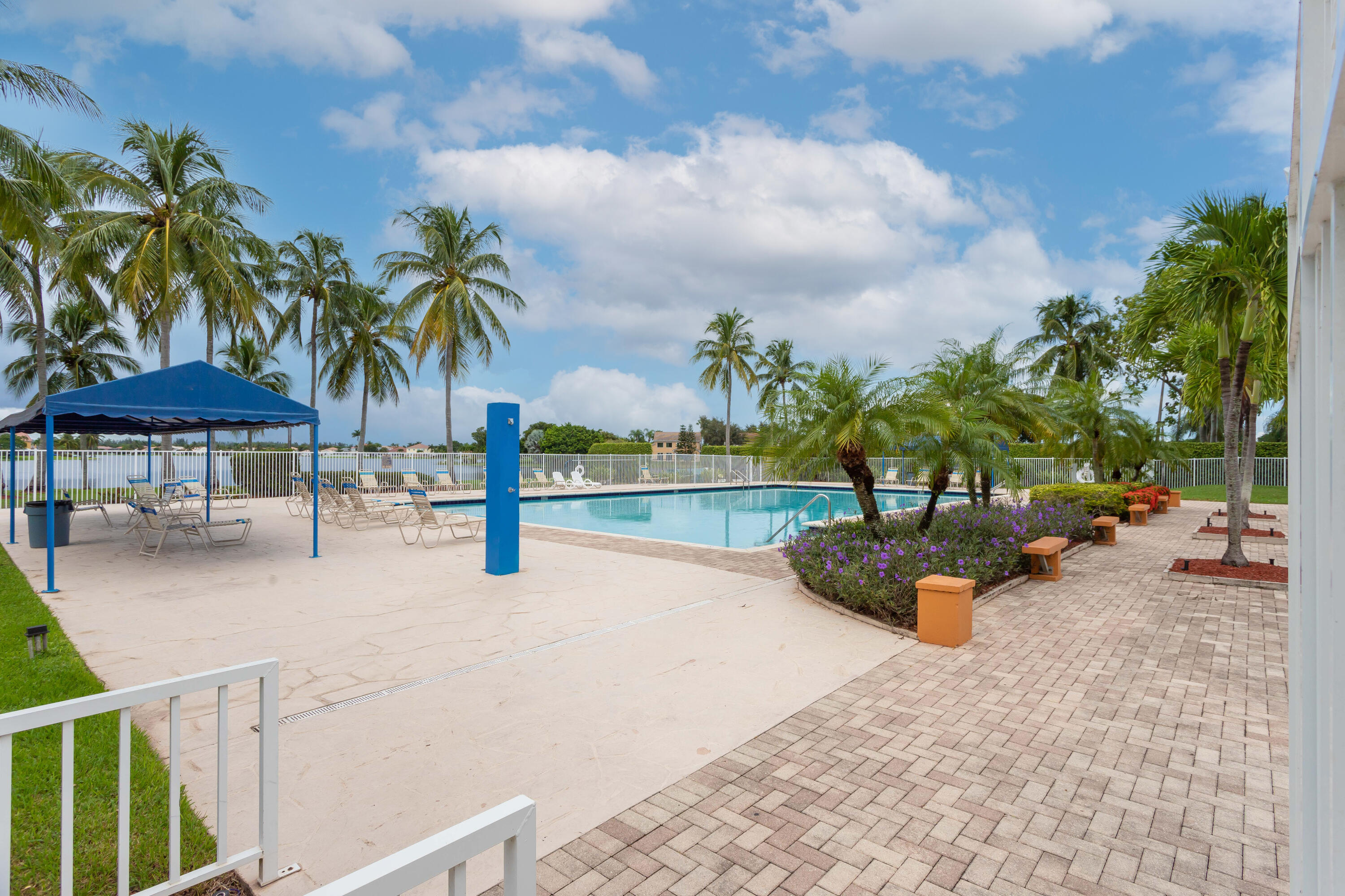 7427 Shell Ridge Terrace Lake Worth, FL 33467 - Photo 26 of 27 an outdoor space with patio furniture and potted plants