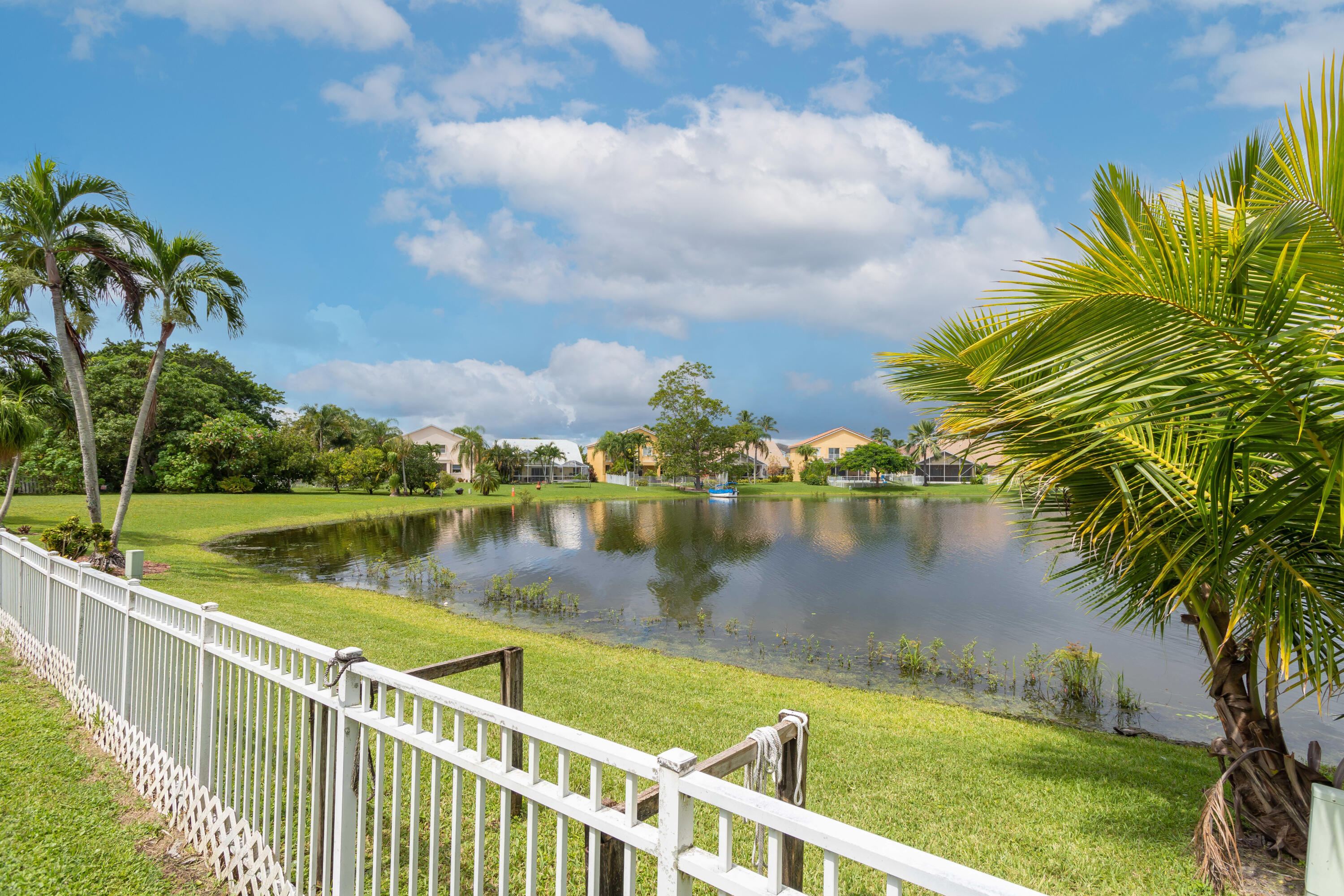 7427 Shell Ridge Terrace Lake Worth, FL 33467 - Photo 3 of 27 a view of a lake from a balcony