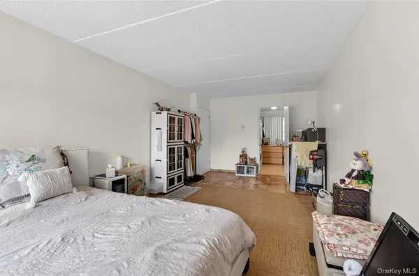 a bed room with a bed and a book shelf