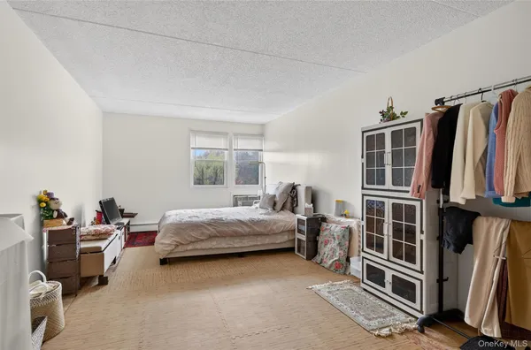 a bed room with a bed and a window