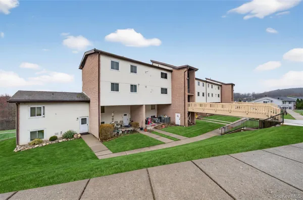 a front view of building with yard