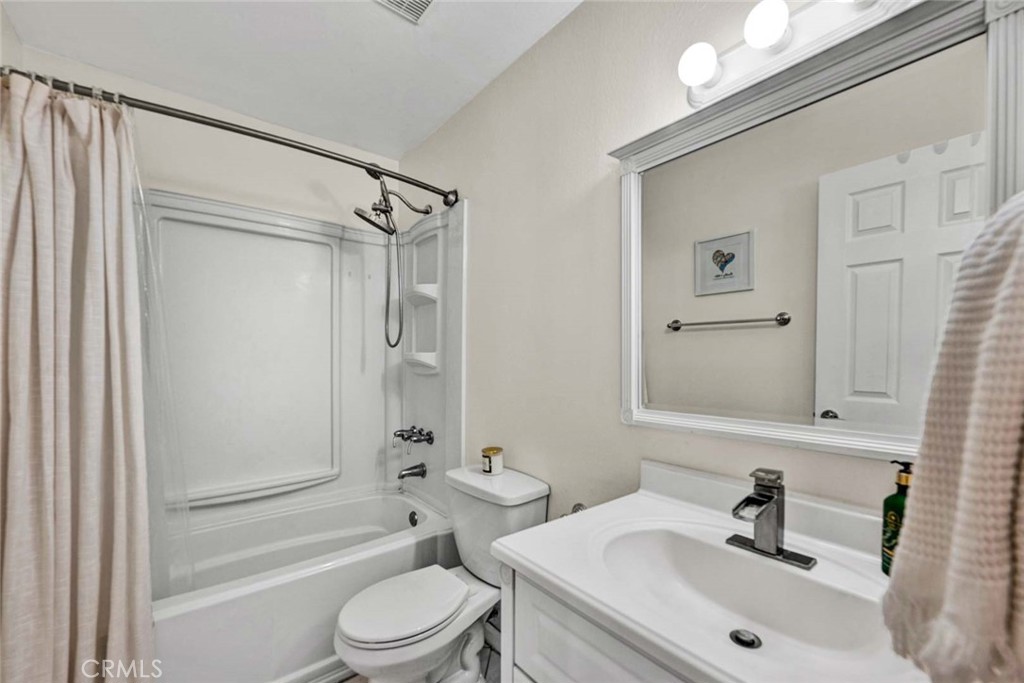 38 Windjammer, Unit 20 Irvine, CA 92614 - Photo 14 of 25 a bathroom with a sink toilet and shower