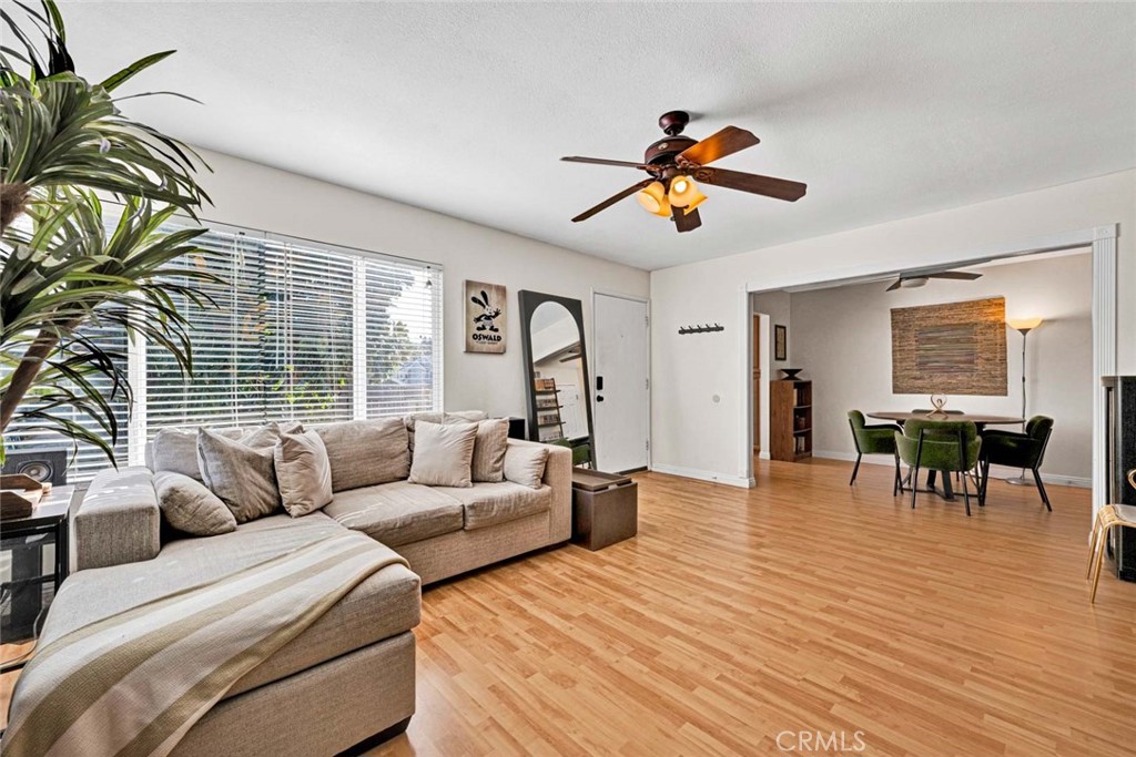 38 Windjammer, Unit 20 Irvine, CA 92614 - Photo 4 of 25 a living room with furniture and a large window