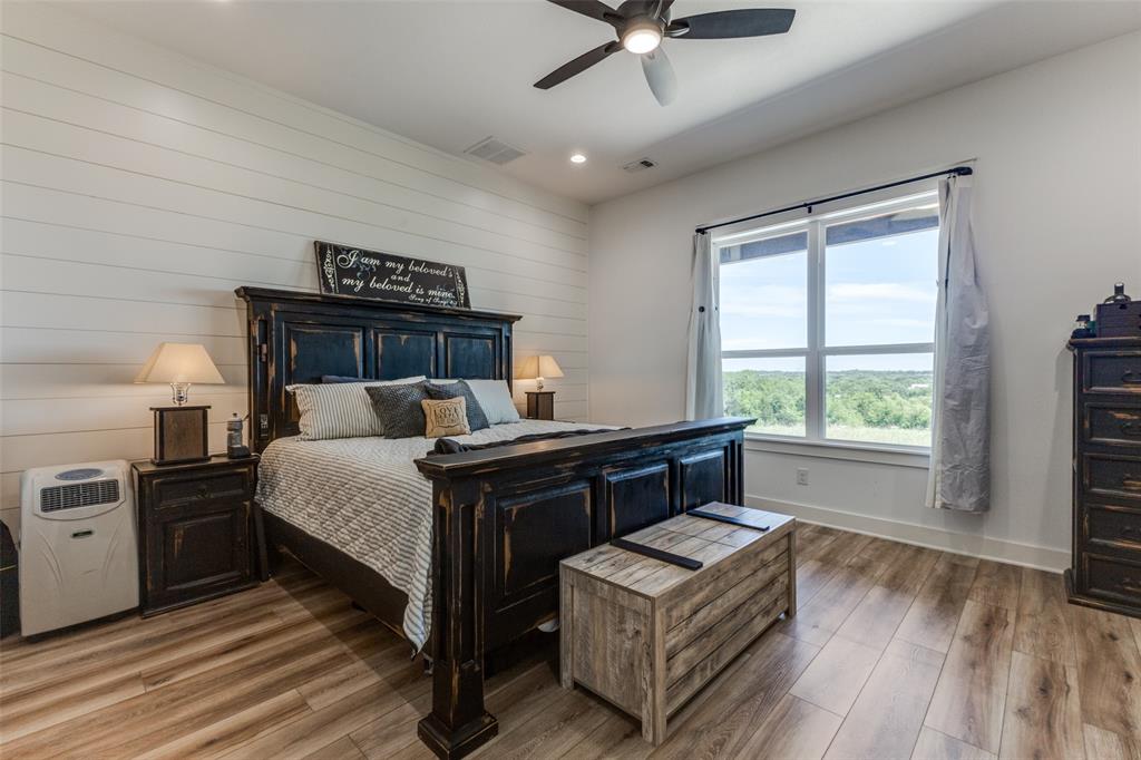 917 Marlow Road Bells, TX 75414 - Photo 14 of 40 a bedroom with a bed and window