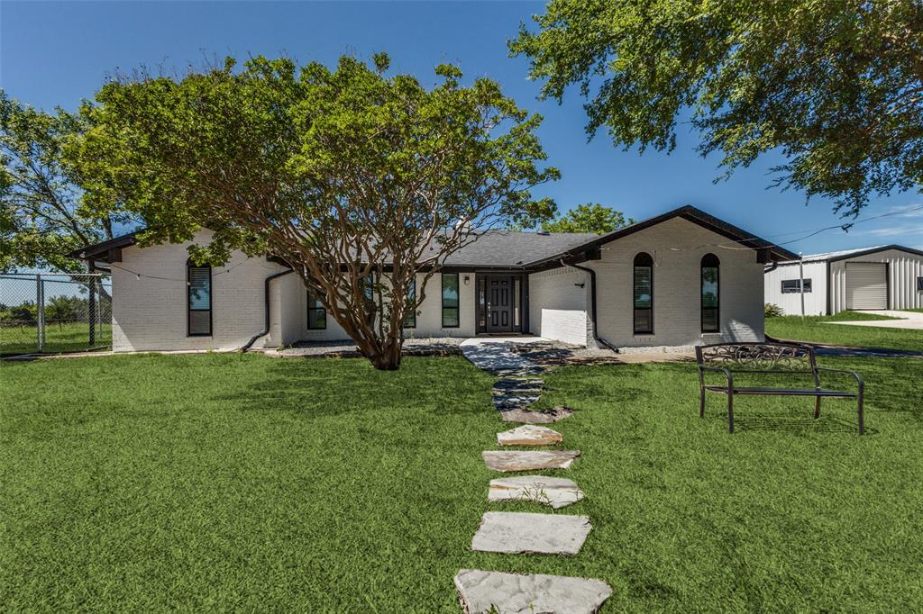 917 Marlow Road Bells, TX 75414 - Photo 2 of 40 a front view of house with a garden