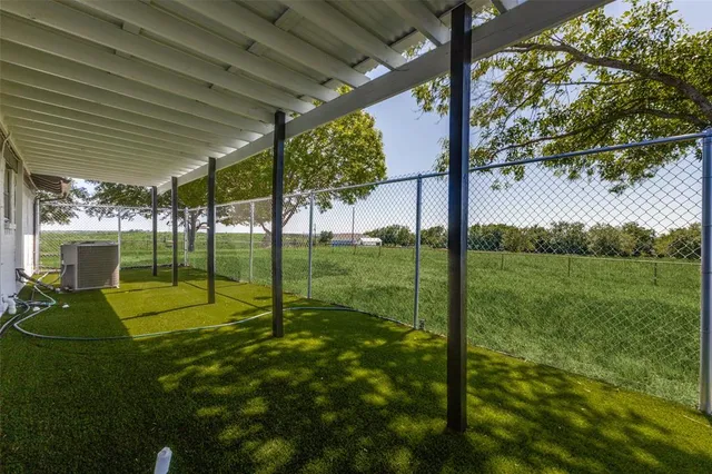 a view of a backyard with a garden