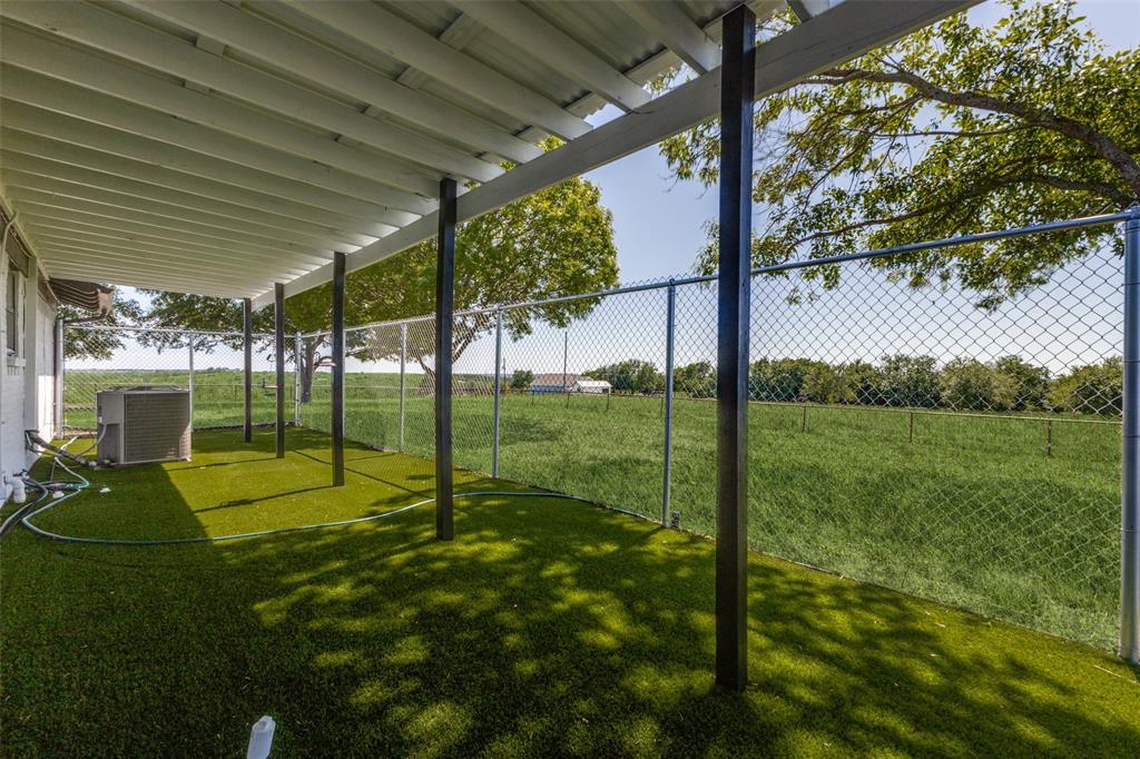 917 Marlow Road Bells, TX 75414 - Photo 29 of 40 a view of a backyard with a garden