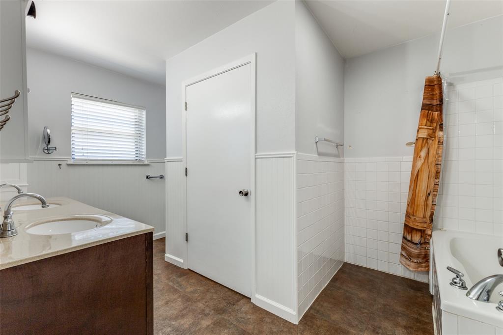 917 Marlow Road Bells, TX 75414 - Photo 33 of 40 a bathroom with a sink and a mirror