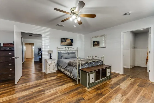 a living room with furniture and a ceiling fan