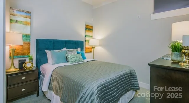 a bathroom with a sink vanity mirror and toilet