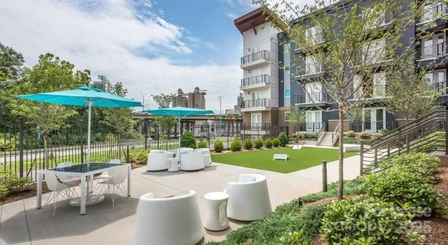 a patio with table and chairs