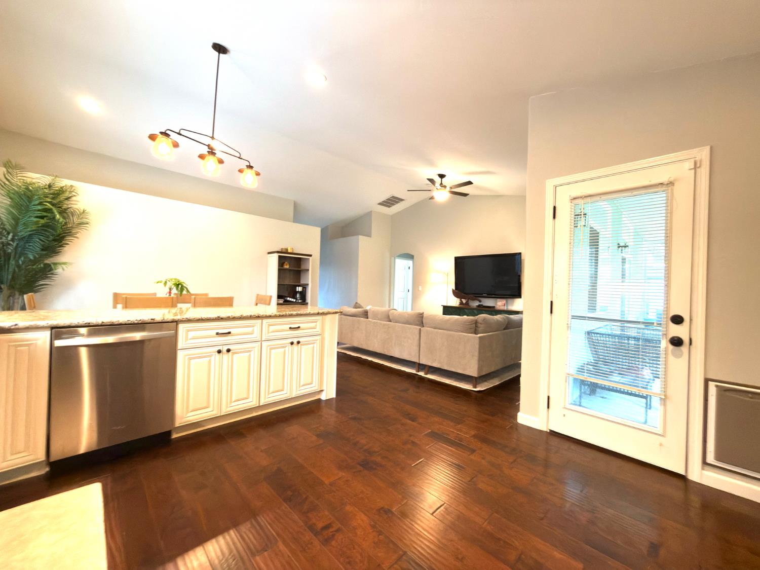 775 Oldenburg Way Galt, CA 95632 - Photo 13 of 31 a view of a kitchen with a sink wooden floor and a kitchen