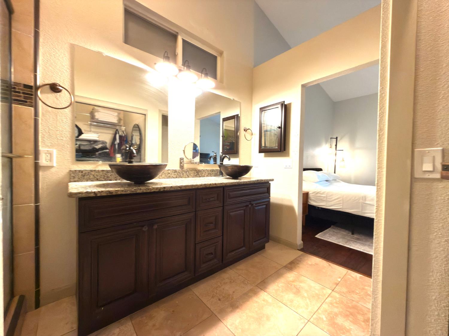 775 Oldenburg Way Galt, CA 95632 - Photo 23 of 31 a en suite bathroom with a sink and a large mirror