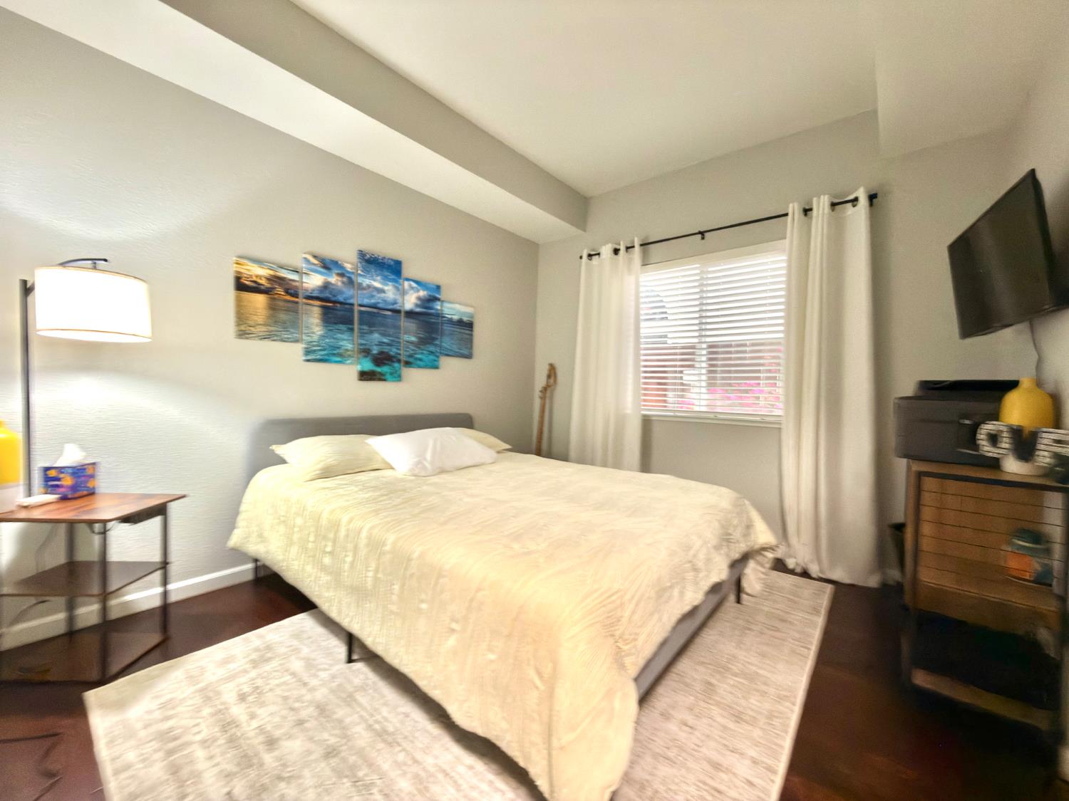 775 Oldenburg Way Galt, CA 95632 - Photo 29 of 31 a bedroom with a bed and a flat tv screen on dresser
