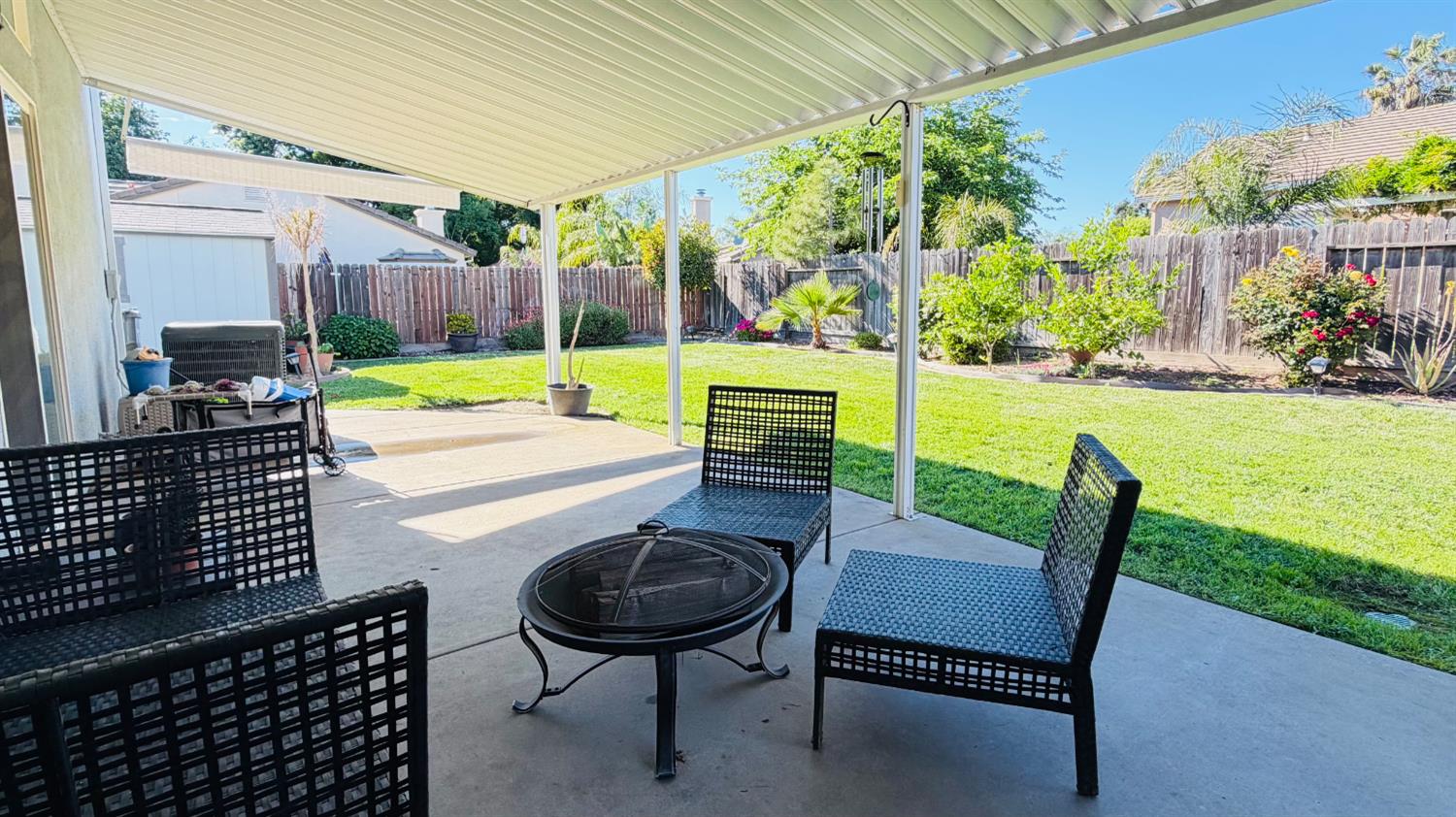 775 Oldenburg Way Galt, CA 95632 - Photo 30 of 31 a patio with garden area and outdoor seating