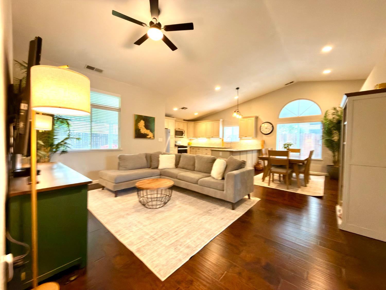 775 Oldenburg Way Galt, CA 95632 - Photo 3 of 31 a living room with kitchen island furniture and a wooden floor