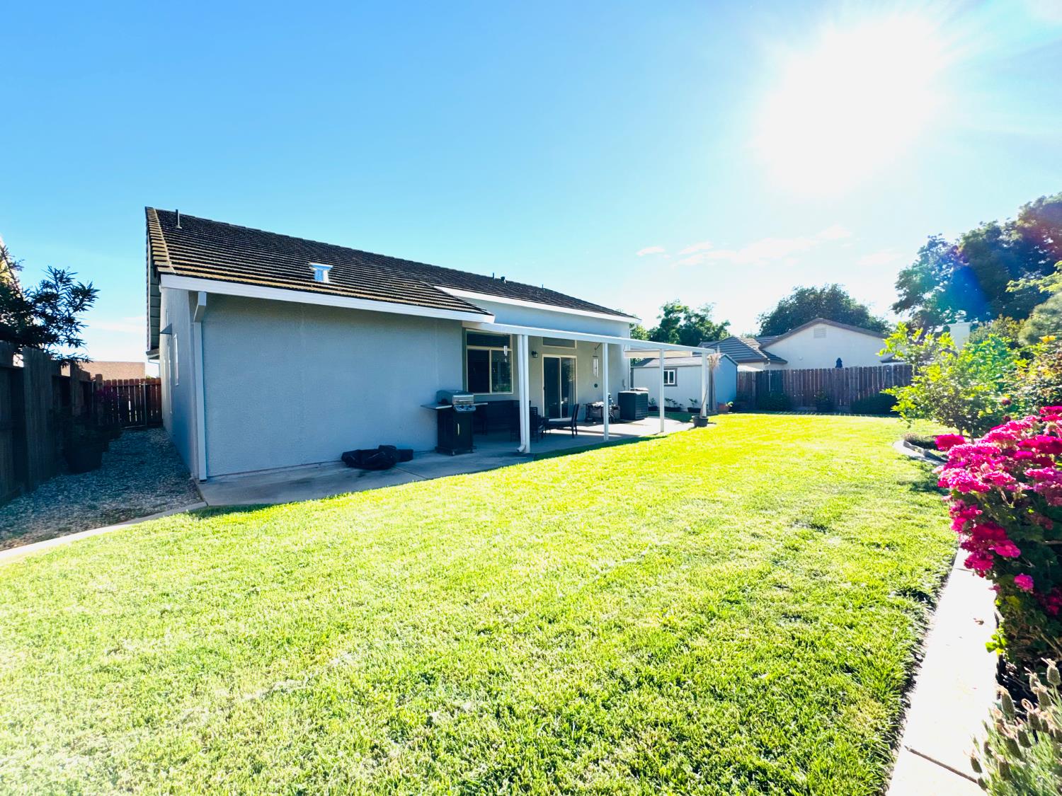 775 Oldenburg Way Galt, CA 95632 - Photo 31 of 31 a swimming pool with outdoor seating and yard