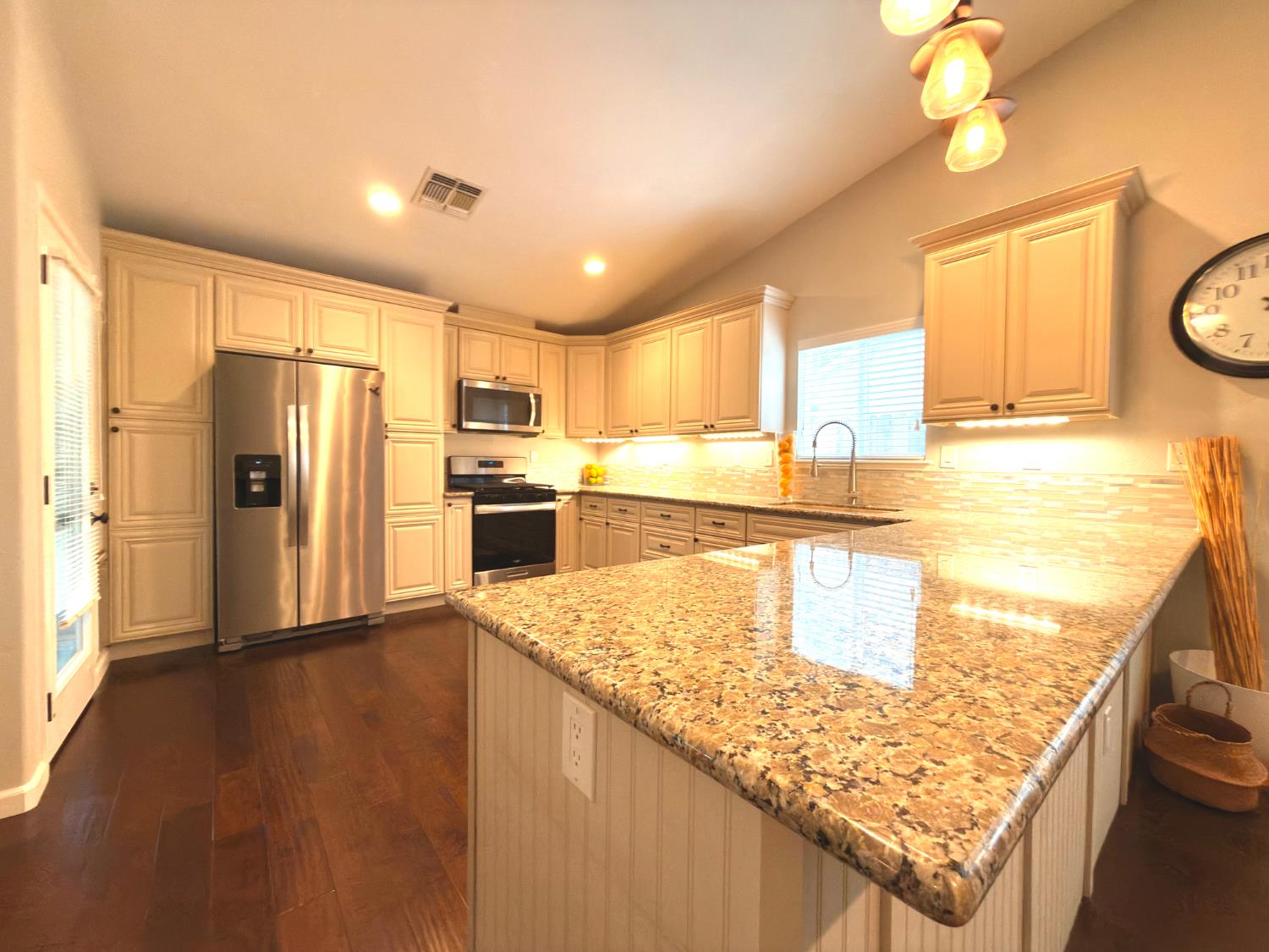 775 Oldenburg Way Galt, CA 95632 - Photo 6 of 31 a kitchen with stainless steel appliances granite countertop a sink refrigerator and microwave