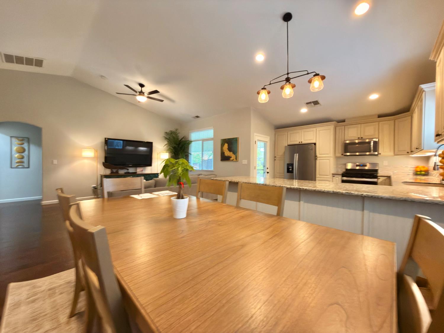 775 Oldenburg Way Galt, CA 95632 - Photo 7 of 31 a large kitchen with kitchen island a counter space a sink appliances and a counter top space