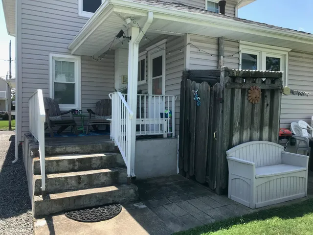 a view of two chairs in the patio