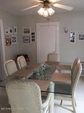 a bedroom with furniture and a chandelier