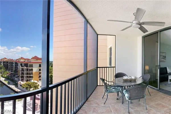 a view of a balcony with furniture