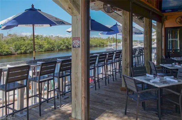 a view of chairs and table in the patio
