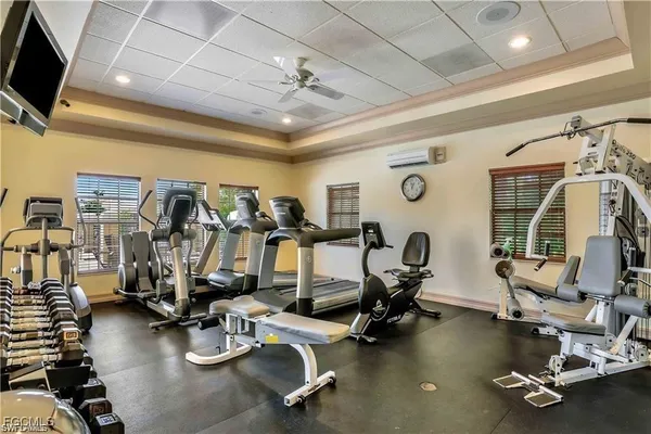 a room with gym equipment and windows