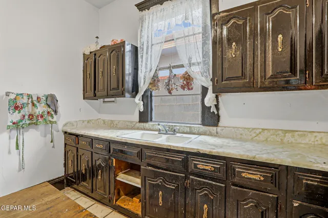 a kitchen with stainless steel appliances granite countertop a stove and a refrigerator