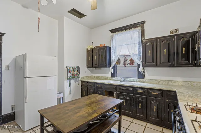 a bedroom with furniture and a flat screen tv