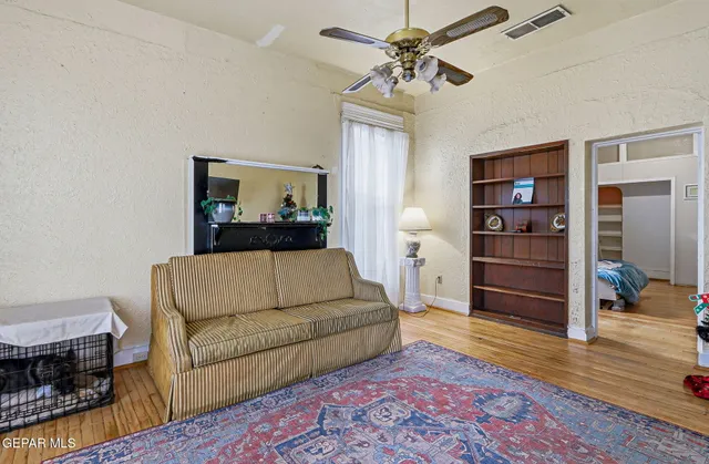 a bedroom with bed and a window