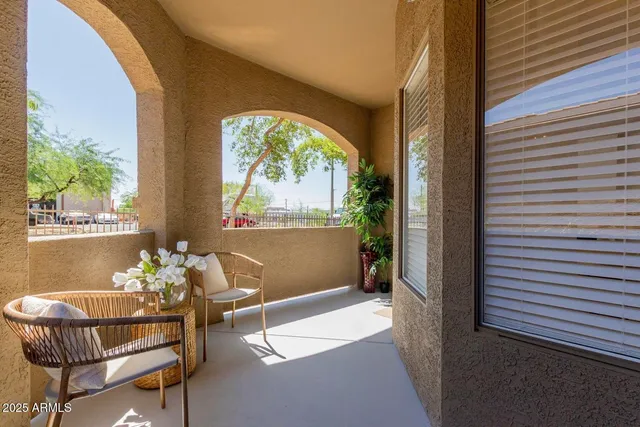 a dining room with furniture and a window