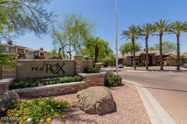 a view of multiple houses with a street