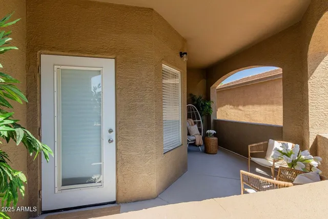 a view of a livingroom with furniture and windows