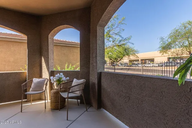 a dining room with furniture and a floor to ceiling window