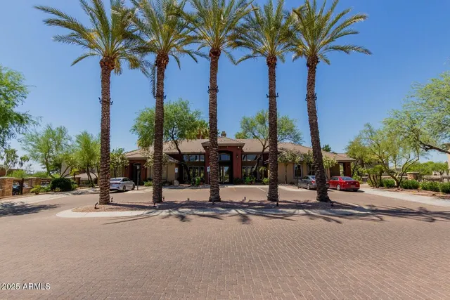 a view of a water fountain in front of a house