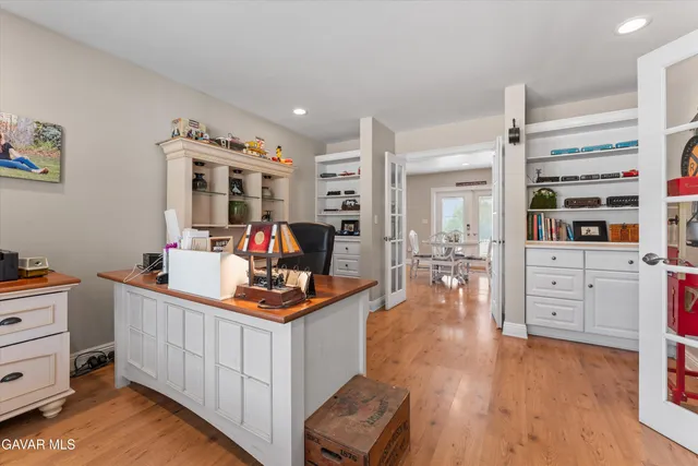 a bathroom with a toilet a sink and a mirror
