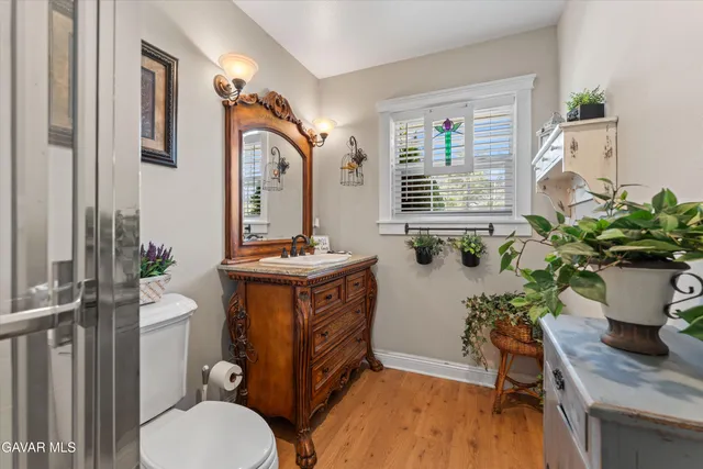 a kitchen with a white stove top oven sink and cabinets