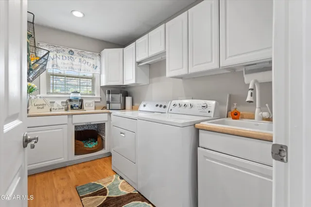 a living room with furniture fireplace and wooden floor