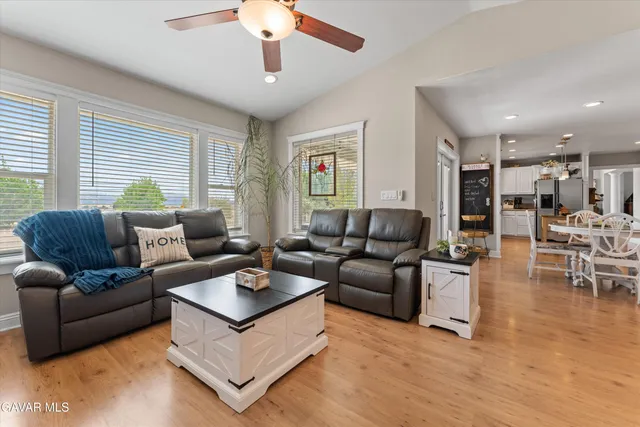 a dining room with furniture and wooden floor