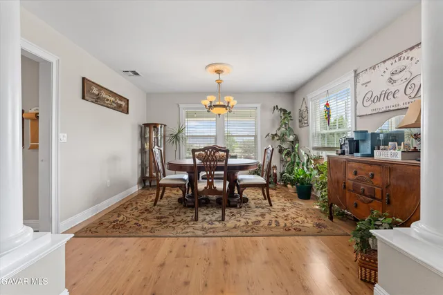 a view of staircase with wooden floor and a rug