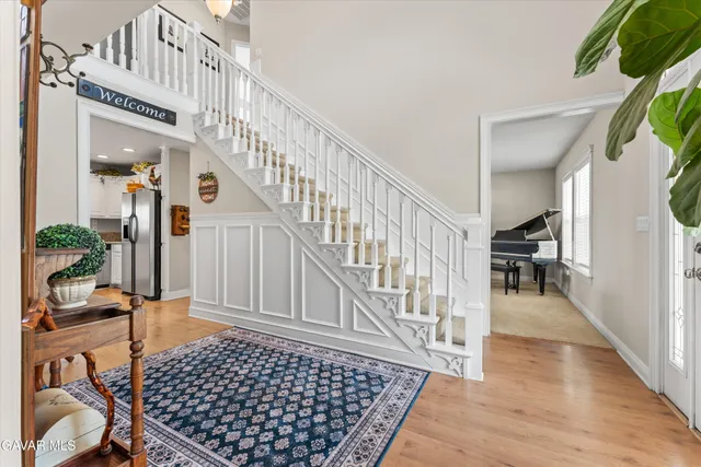 a hallway with a dining table and chairs