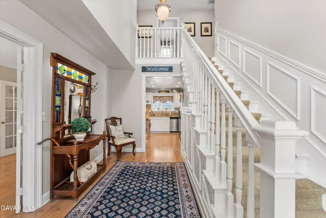 a living room with furniture rug and a table